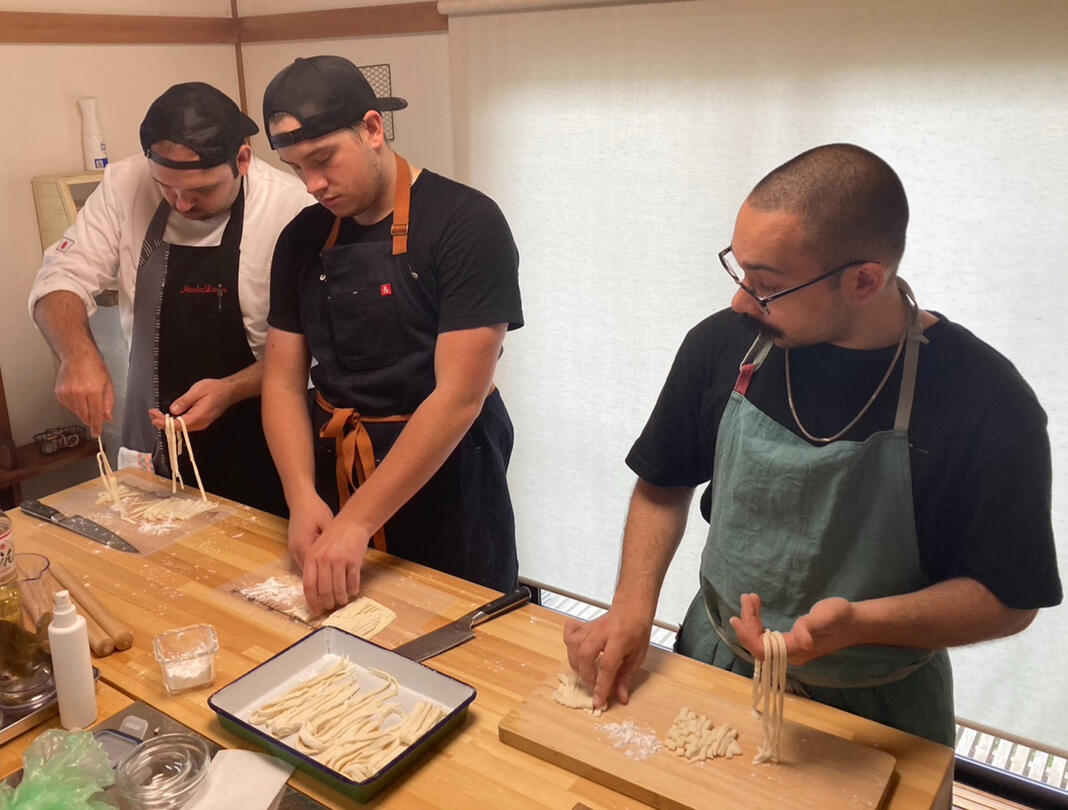 Udon being cooked by Cooking Mogu students in cooking class near Tokyo in Saitama Japan